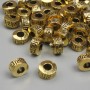 Jewellery findings gold-colour bead insert, diameter 6.5x4mm+/-, hole diameter 2.8mm+/-, pack 20g (~37 pcs)
