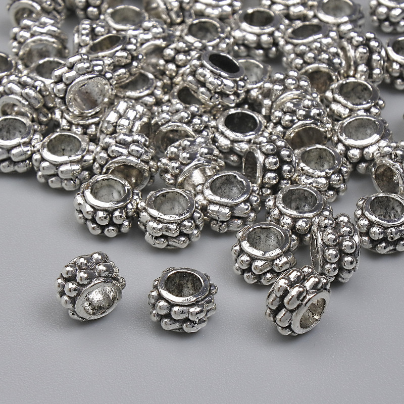 Jewellery findings silver-colour bead insert, diameter 5.5x3.5mm+/-, hole diameter 2.9mm+/-, pack 20g (~60 pcs)