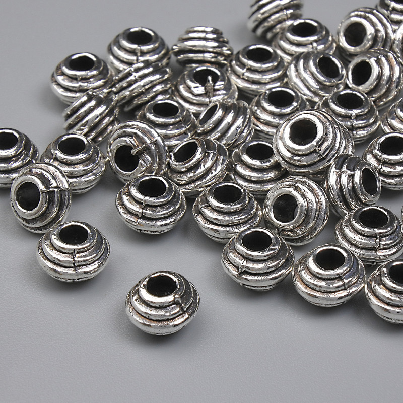 Jewellery findings silver-colour bead insert, diameter 6x4.5mm+/-, hole diameter 2.5mm+/-, pack 20g (~42 pcs)
