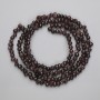Garnet Beads, tumbled, diameter 5.5-6.5x4-5mm+/- on fishing line, length 80cm+