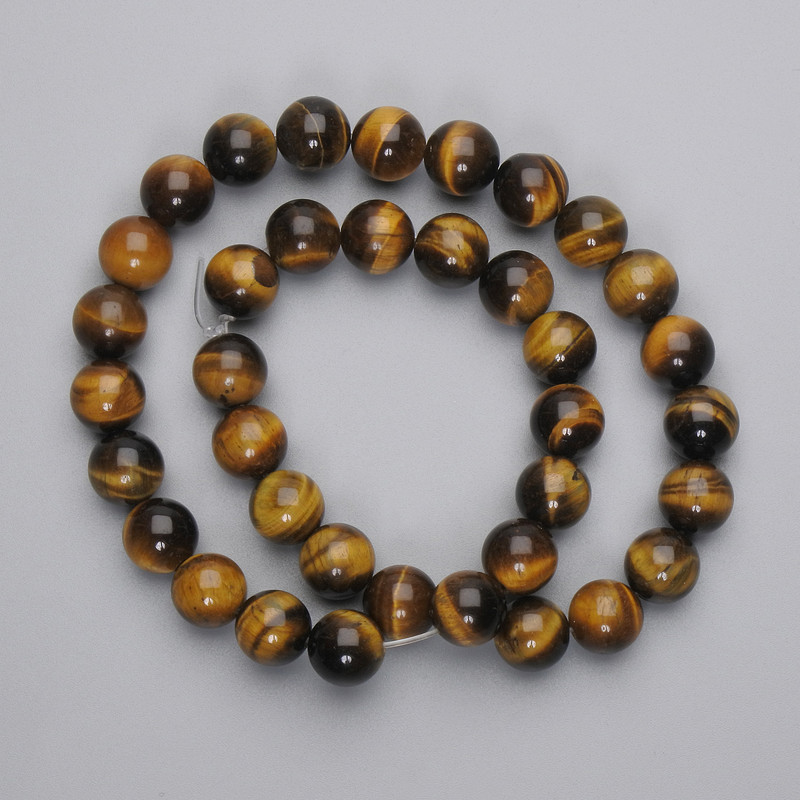 Tiger's Eye Beads, smooth round, diameter 10mm+/- on fishing line, length 37cm+