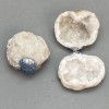 Souvenir pair geode of rock crystal on metal clamp, approx 50x45x35mm each