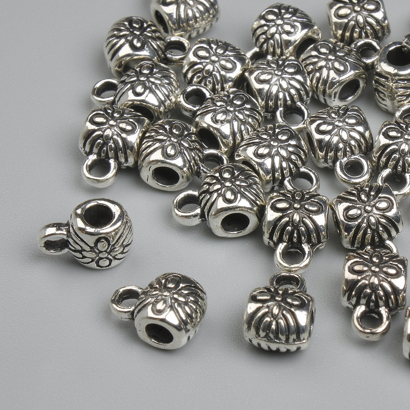 Ball end crimp/loop findings in silver-colour metal, size 8x4.5mm, holes 2–3mm, packaging 26 pieces