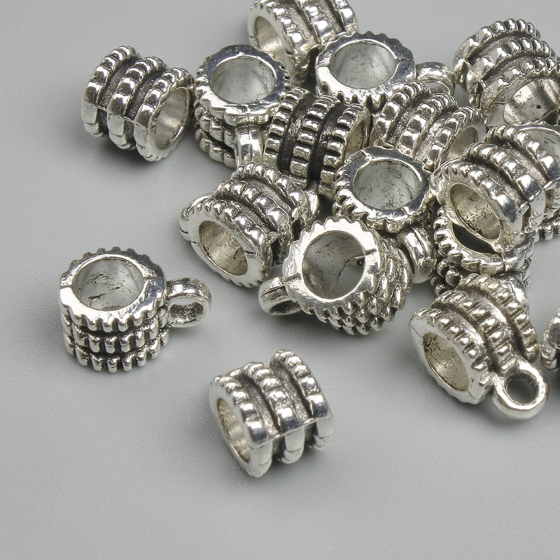 Silver-colour bail finding, size 6.5×9.5 mm ± hole diameters 2.2 mm and 4.6 mm ± packing 18 pcs