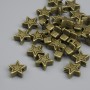 Bead finding star inlay bronze colour, diameter 6×2.5 mm ± hole 1.5 mm, packaging ~25 pcs
