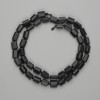 Shungite Beads, faceted 7–8×5–6 mm, on thread, approx. 40 cm