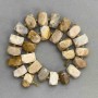 Trapped fossilised coral faceted beads 16-19×11-12mm+- beads 4mm+-, length 40cm+- on a thread