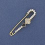 Brooch pin with a shamrock and white crystals 58×15mm± gold-tone metal
