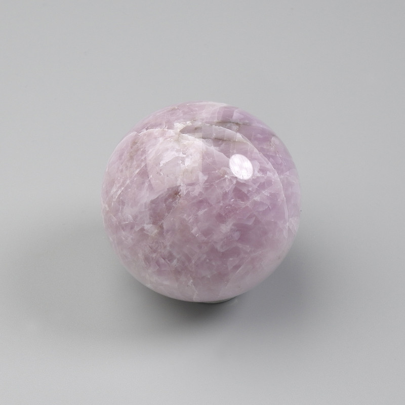 Souvenir sphere of natural kunzite, diameter 30-45mm+- assorted sizes (price per 100 g) weight from 120 g