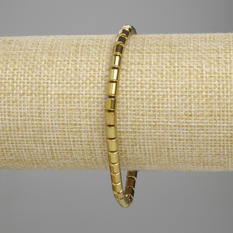 Hematite Cylinder Bracelet 5×4mm+- gold colour, length 18cm+- stretch
