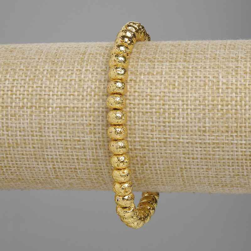 Bracelet Lava with golden metallic coating porous rondelle 6x4.5mm+-, length 18cm+-, stretch
