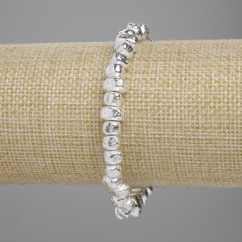 Bracelet Lava with silvered metal plating, porous faceted bead, 6.5-8.5mm, 4-5mm, length 18cm, stretch