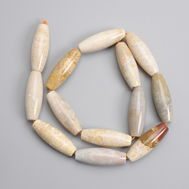 Fossilised coral beads elongated oval 30×10mm, length 38cm on a thread