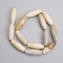 Fossilised coral beads elongated oval 30×10mm, length 38cm on a thread