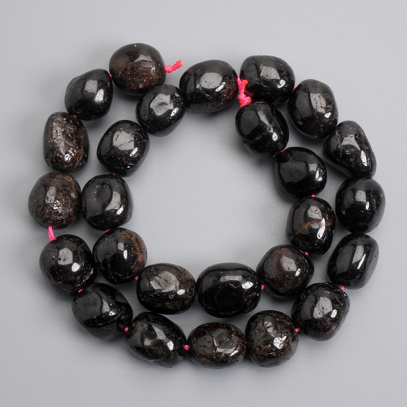 Garnet faceted beads on thread 15-18×11-13mm+, length 38cm±