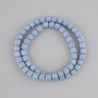 Blue volcanic lava cylinder beads, 6x6mm diameter, on cord, length 37cm+