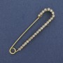 Brooch pin with white crystals 72x16mm+ - gold-toned metal