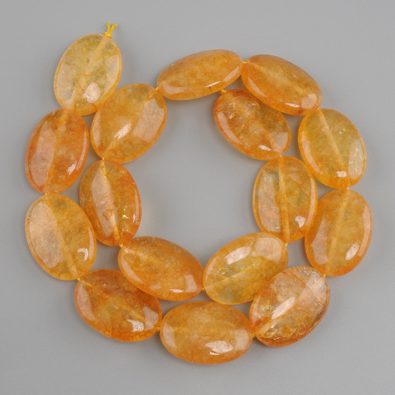 Citrine beads oval, diameter 25x18mm ±, thread length 39cm ±