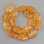 Citrine beads oval, diameter 25x18mm ±, thread length 39cm ±