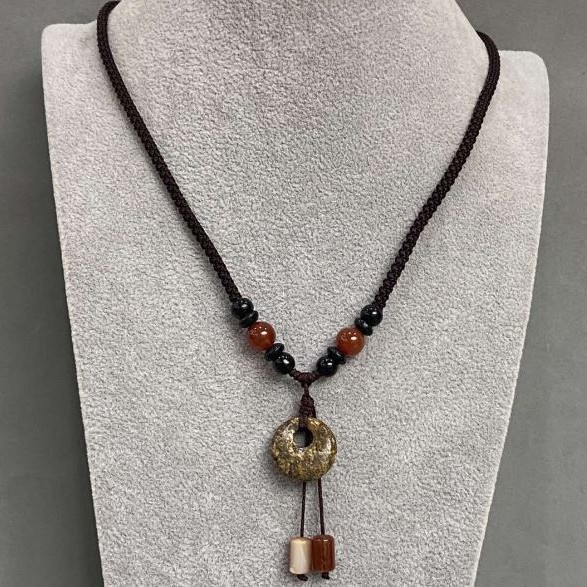 Pendant 'Bagel' Jasper on a cord with Agate and Carnelian beads, length 65 cm