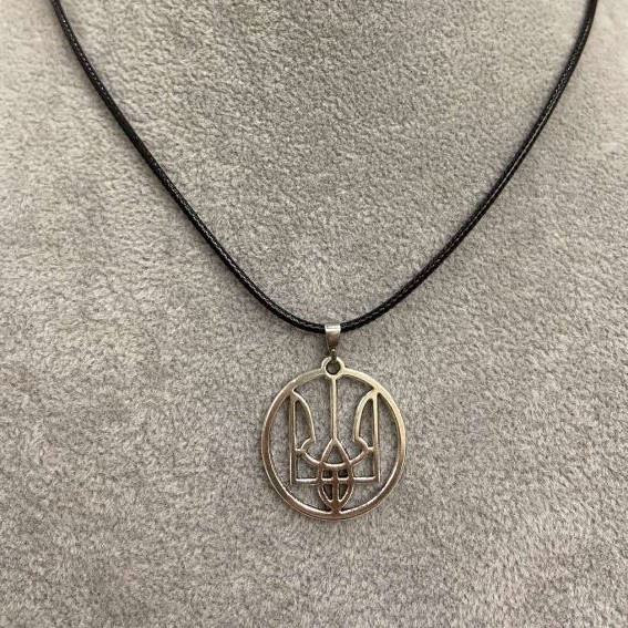 Pendant Trident in a Circle, diameter 25 mm ± silver-toned metal on eco-leather cord, length 60 cm +5 cm extension chain