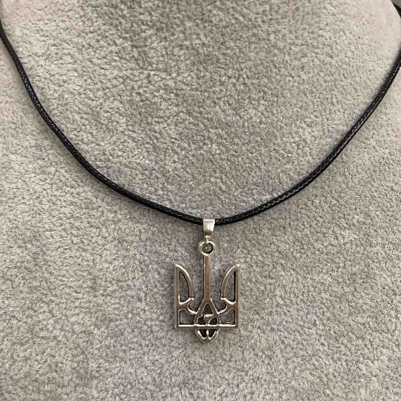 Pendant Trident 25x15mm+- silver-coloured metal on eco-leather cord, length 60cm +5cm chain