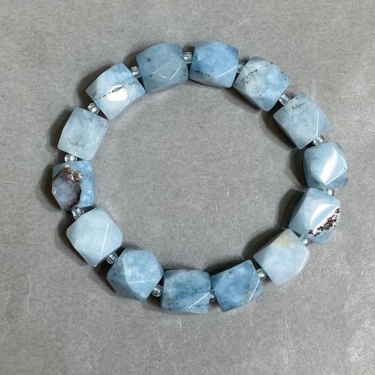 Aquamarine bracelet faceted, diameter 12x10–11mm +- bead 3mm +- , length 18cm +- stretch