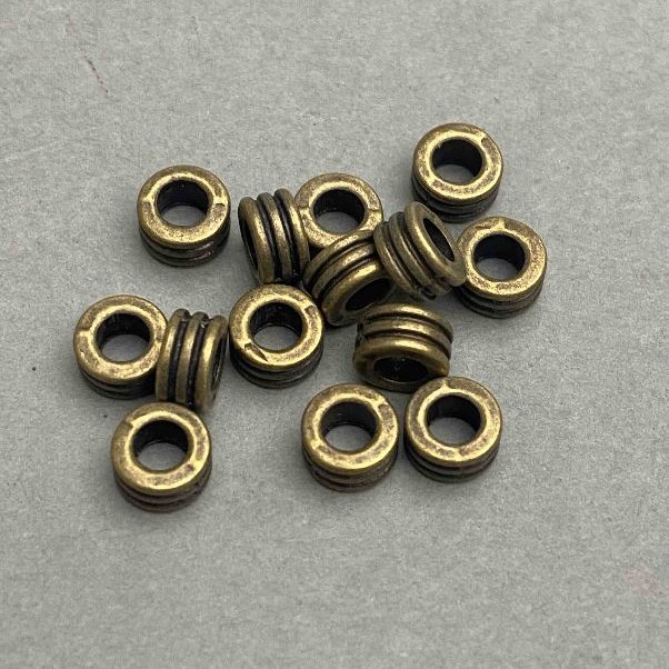 Bead insert bronze tone, metal colour, diameter 7x4mm ± hole, diameter 3, 6mm ± ~50 pcs +