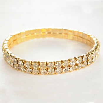 Elegant two-row elastic bracelet with rhinestones, white crystals on golden metal, 17 cm circumference