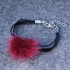 Leather-like burgundy bracelet with natural fur