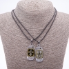 Matching Friendship Pendants "Love on a Cord", length 45cm, metal colour "silver and bronze"