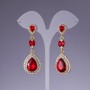 Earrings with red crystals, length 6cm, yellow metal