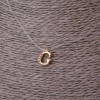 Pendant, diameter 9mm, on invisible silicone cord, length 39-44cm