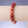 Elastic bracelet with natural stone Sardonyx smooth bead, diameter 10+