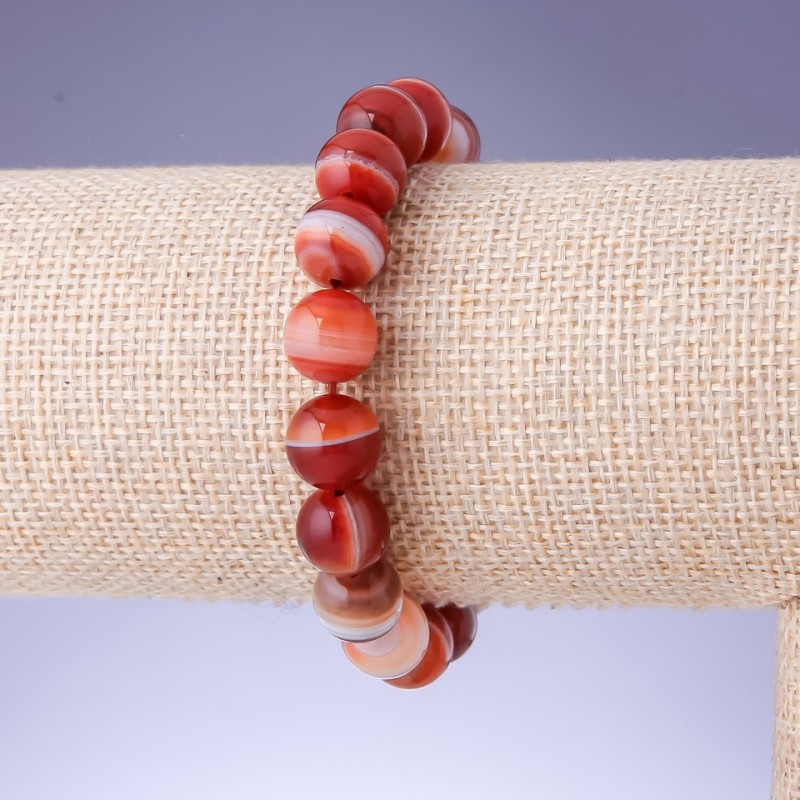 Elastic bracelet with natural stone Sardonyx smooth bead, diameter 10+