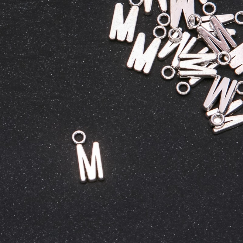 Pendant Finding Letter "M" 17x7mm packaging 20g (+- 15 pcs)