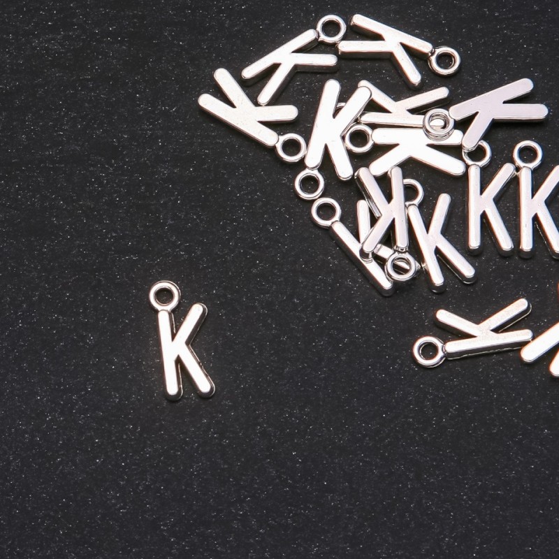 Pendant Fittings Letter "K" 17x7mm Packaging 20g (+- 25pcs)