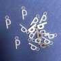 Pendant hardware Letter "P" 17x7mm packaging 20g (+- 30 pcs.)