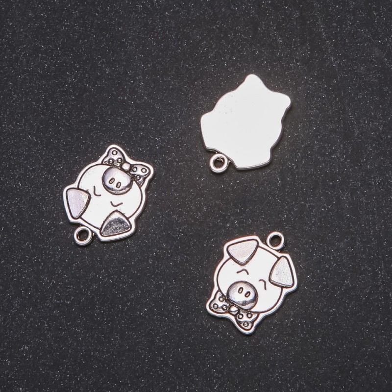 Pendant Finding Piglet 16x20mm packaging 20g +/- 9 pcs