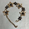 Bracelet Lilies with black crystals, dark gold colour, 25mm wide, 19–25cm length