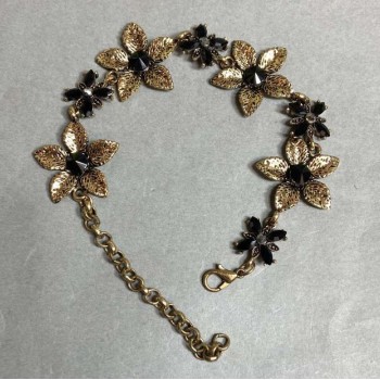 Bracelet Lilies with black crystals, dark gold colour, 25mm wide, 19–25cm length
