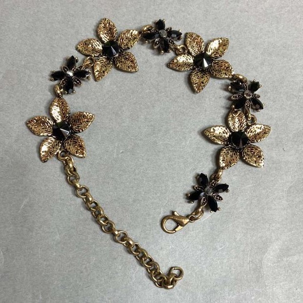 Bracelet Lilies with black crystals, dark gold colour, 25mm wide, 19–25cm length