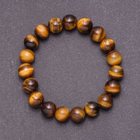 Bracelet made of natural tiger's eye on elastic, bead diameter 12mm, circumference 18cm