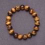 Bracelet made of natural tiger's eye on elastic, bead diameter 12mm, circumference 18cm