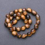 Tiger's Eye Beads on Thread - faceted, 9–12×8 mm, length 38 cm