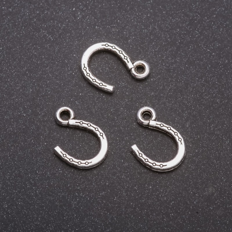 Pendant Finding Horse Shoe, diameter 10x14mm, diameter inmm packaging 20g approx. 44 pcs