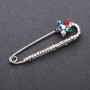 Brooch pin with multicoloured glass crystals 64×19mm white metal