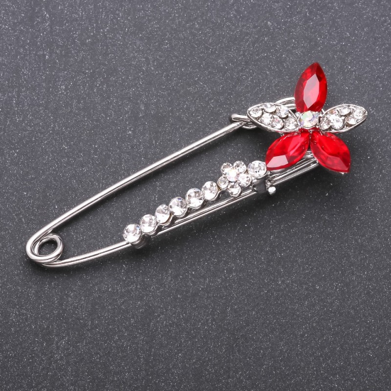 Brooch pin with red glass crystals 68x23mm white metal