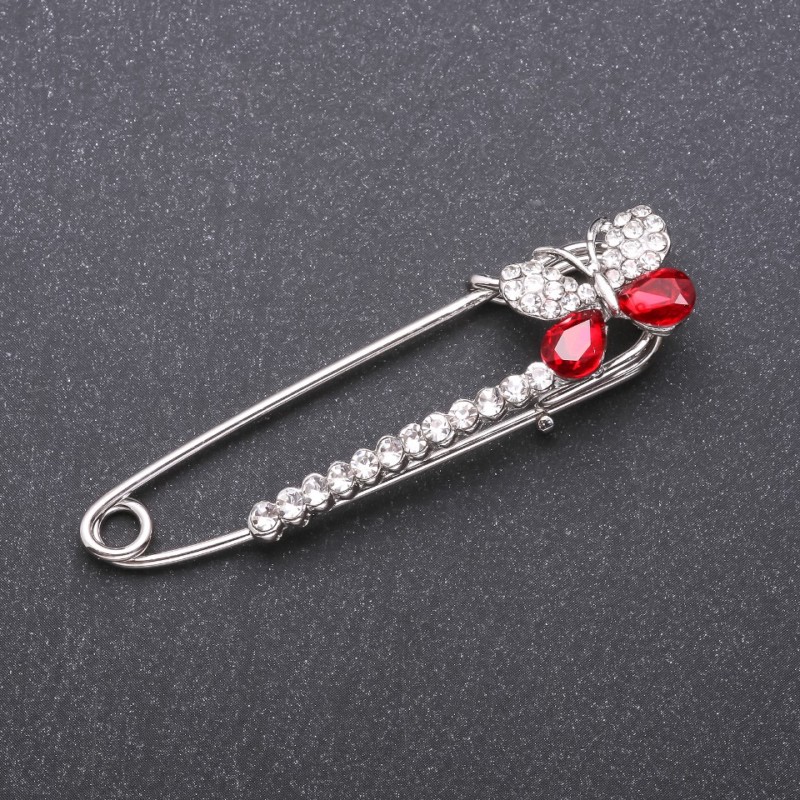 Brooch pin with red glass crystals 66×15mm white metal