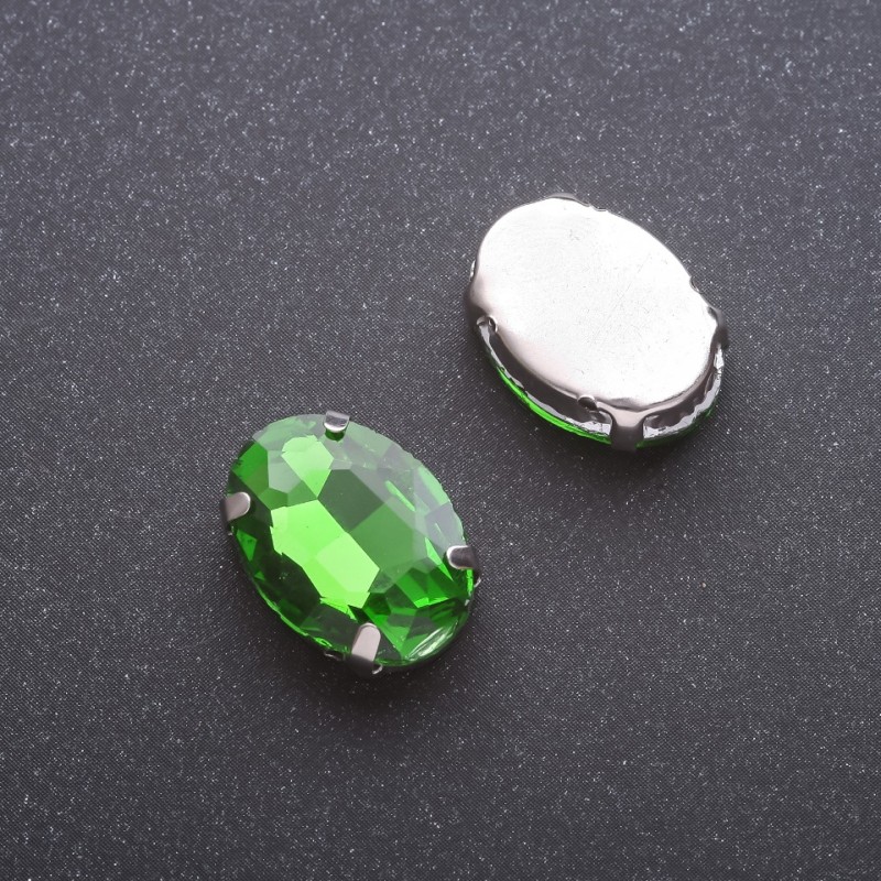 Price per pack of 10 pcs. Sew-on crystal in claw setting, oval 13x18mm, green